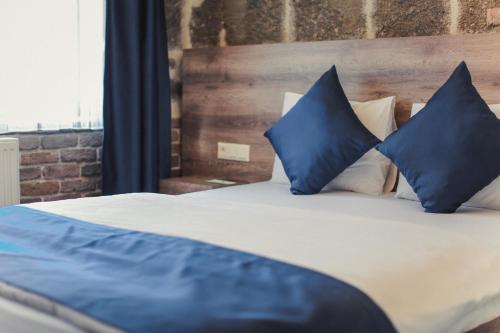 Ένα ή περισσότερα κρεβάτια σε δωμάτιο στο TS Park Hotel