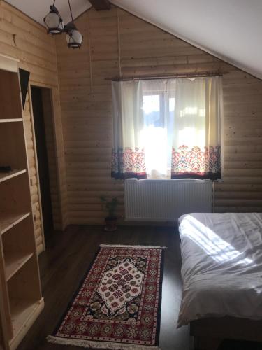 Letto o letti in una camera di Cabana Todireni Vatra Dornei