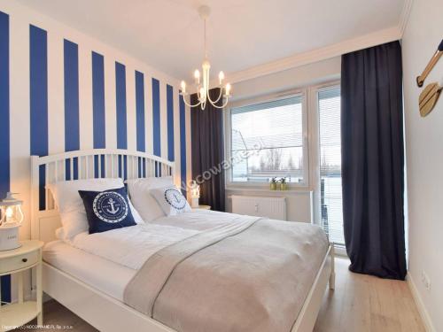 Posteľ alebo postele v izbe v ubytovaní Apartament Bliżej Morza Premium I