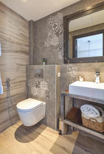 a bathroom with a white toilet and a sink at Residence Provencal - Luxurious - 300m Palais - LRA CANNES in Cannes