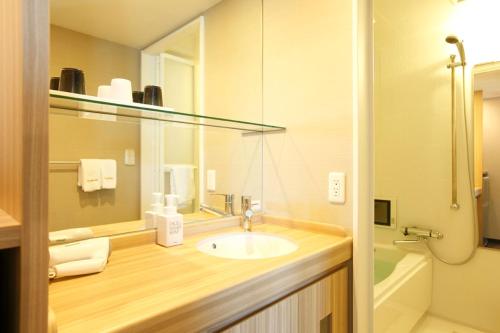 Vonios kambarys apgyvendinimo įstaigoje Dormy Inn Express Matsue