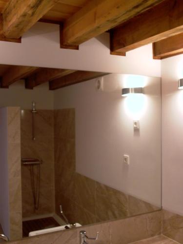 a bathroom with a shower with a glass door at Quinta da Lapa in Manique do Intendente
