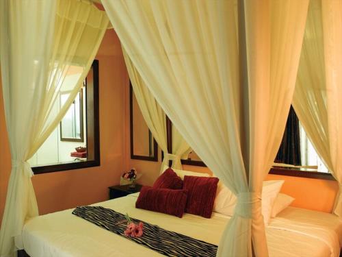 Ліжко або ліжка в номері A'Famosa Villas