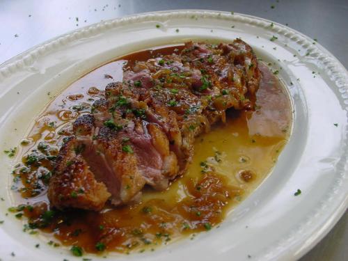 a plate of food with a piece of meat with sauce at Trigony Hotel and Garden Spa in Closeburn