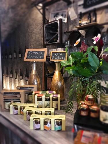 a store with a shelf with bottles of wine at Elakati Luxury Boutique Hotel - Adults Only in Rhodes Town