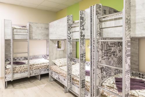 a room with four bunk beds in it at Art хостел-готель "Адреналін" in Luts'k