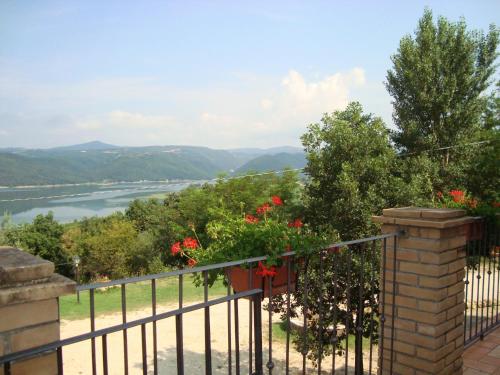 a balcony with a view of a river and mountains at Poggio San Giacomo in Baschi