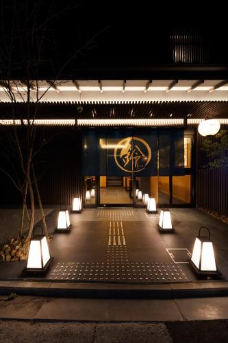 a row of lights in front of a building at night at Rinn Kamiebisu in Kyoto