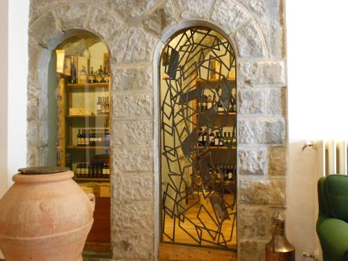 a glass door in a room with a vase at Hotel Bellavista in Abetone