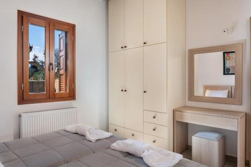 Postel nebo postele na pokoji v ubytování Androulakis Apartments