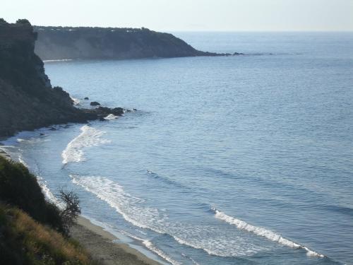 a view of a beach with the ocean at Notos Villas in Frangokastello
