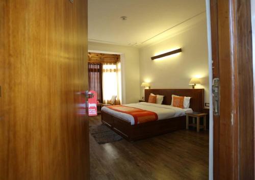 a hotel room with a bed and a window at Himalayan Retreat-Karzoo in Leh