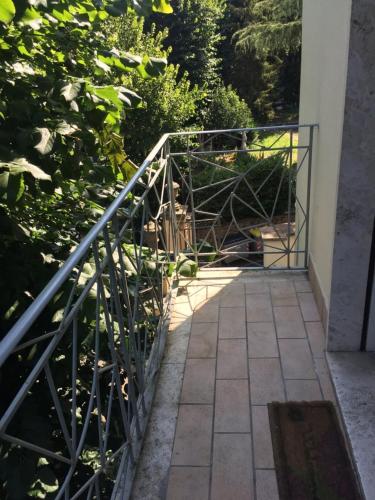 a walkway with a metal railing and a gate at Appartamento a Viterbo in Viterbo