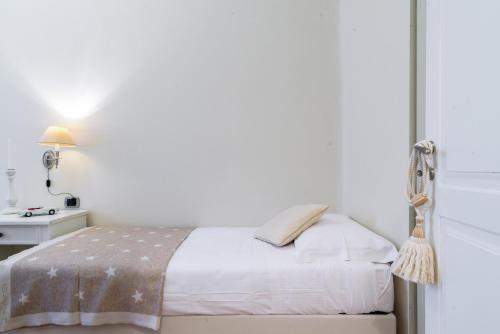 Cama o camas de una habitación en Palazzo Garibaldi - MyHomeInComo