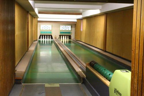 an empty bowling alley with lanes at Hotel Rauch in Ettringen