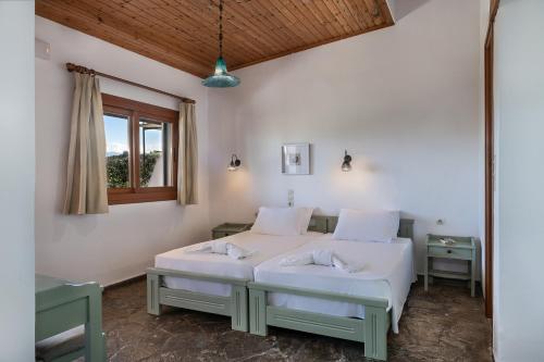 Postel nebo postele na pokoji v ubytování Androulakis Apartments