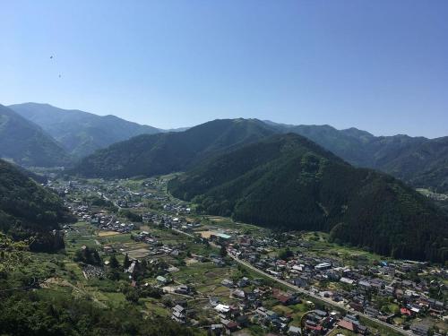 an aerial view of a town in the mountains at Shinshu Wakaho Gibier B&B in Nagano