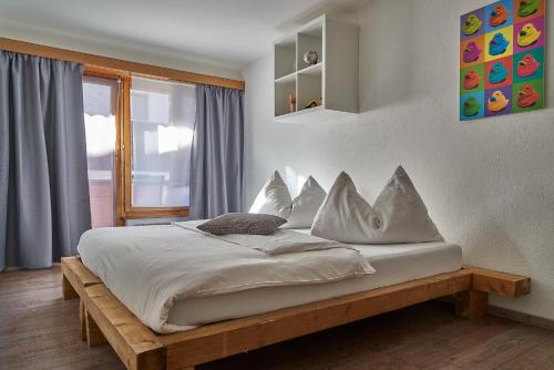 Ένα ή περισσότερα κρεβάτια σε δωμάτιο στο Hotel Marmotte