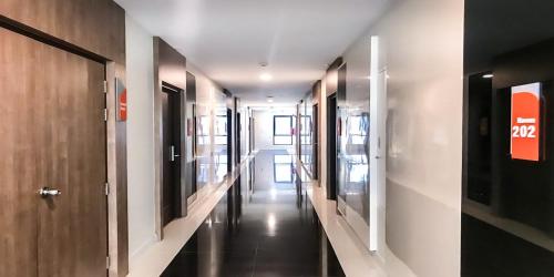 a hallway with a row of walkways in a building at Fortune Hotel Buriram in Buriram
