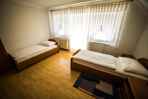 Letto o letti in una camera di Gostišče Pri Dveh Petelinih