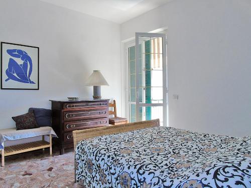 Ένα ή περισσότερα κρεβάτια σε δωμάτιο στο Il Mare A Due Passi
