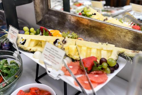 a display of fruit and vegetables on a table at Hotel Villa Baltica in Sopot