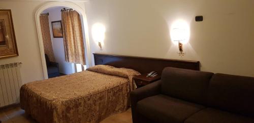 Cama ou camas em um quarto em Hotel Vitalba