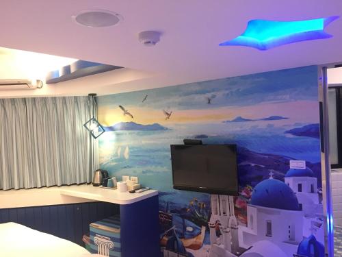 TV a/nebo společenská místnost v ubytování Haozhan Hotel