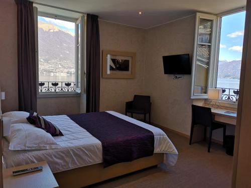 Cama o camas de una habitación en Hotel Helvetia