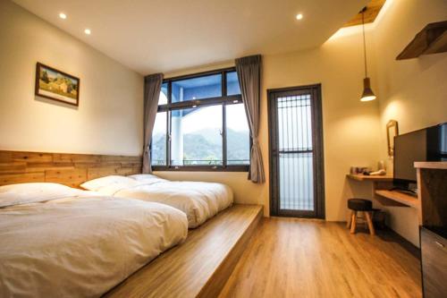 Postel nebo postele na pokoji v ubytování New Live B&B