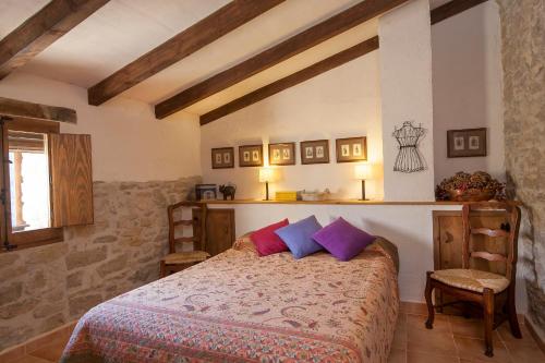 A bed or beds in a room at La Covarxella