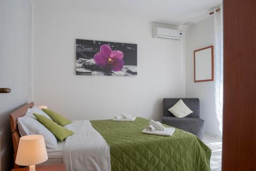 A bed or beds in a room at Green Residence