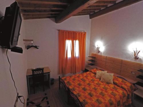 Posteľ alebo postele v izbe v ubytovaní Tenuta La Rosa B&B