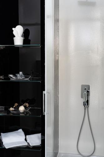 a room with a glass door with a plate of food at White Rooms in Reggio Calabria