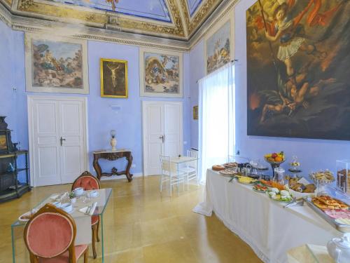 a large room with a table with food on it at Pascaraymondo Suite Palace in Gallipoli