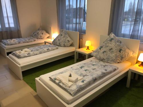 Кровать или кровати в номере Pension Laatzen