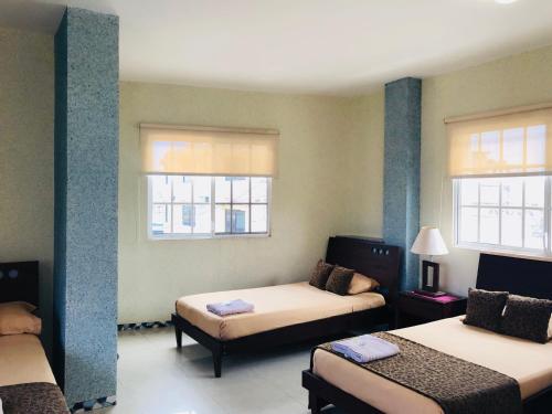 Postel nebo postele na pokoji v ubytování Eco Hotel Katarma
