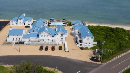 an aerial view of a large house with blue roofs at The Montauk Soundview in Montauk