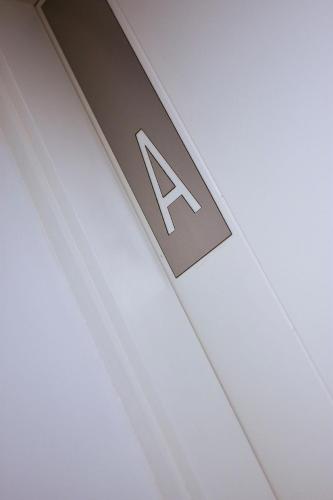 a sign on the ceiling of a building at Aizarker in La Plata