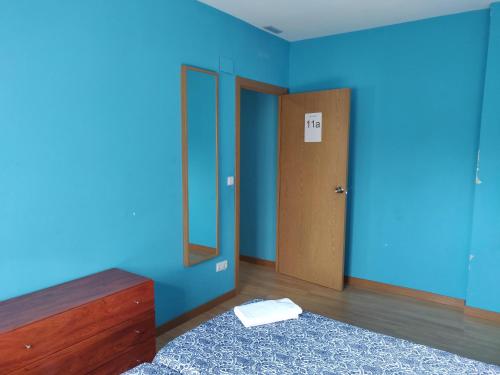 Ένα ή περισσότερα κρεβάτια σε δωμάτιο στο Residencial El Cuartel
