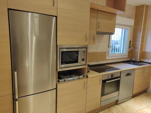 A kitchen or kitchenette at Residencial El Cuartel