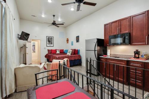 a kitchen and a living room with a couch at N Broad Studios in New Orleans