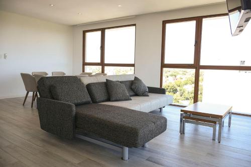 a living room with a couch and a table at Aizarker in La Plata