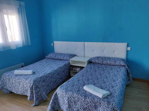 A bed or beds in a room at Residencial El Cuartel