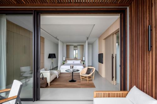 a hotel room with a view of a bedroom at Silversands Resort Grenada at Grand Anse in Grand Anse