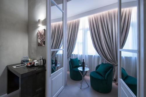 a living room filled with furniture and a window at Terrace Pantheon Relais in Rome