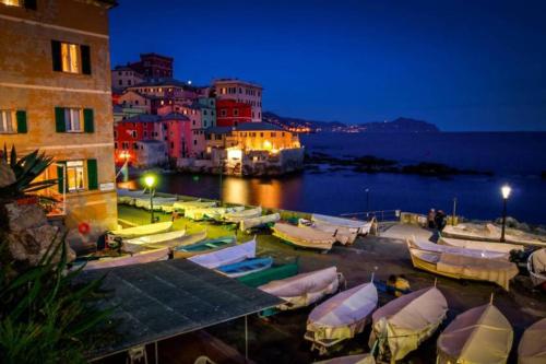 a group of boats parked in a harbor at night at Exclusive Apt Really Downtown - FREE PRIVATE PARKING Included! in Genova