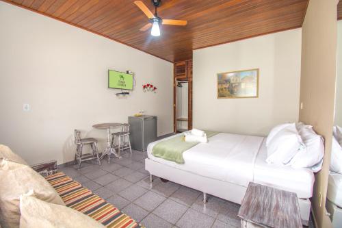 Ένα ή περισσότερα κρεβάτια σε δωμάτιο στο Pousada Casuarina Geribá