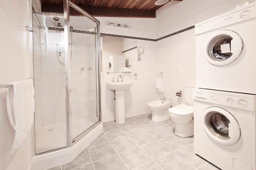 a bathroom with a shower toilet and a sink at Moose 10 in Mount Buller