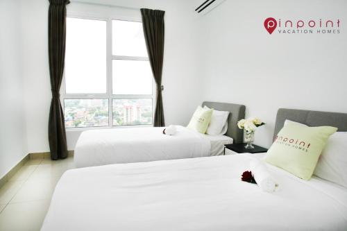 Säng eller sängar i ett rum på JB City Pinnacle Tower @Pinpoint Vacation Homes